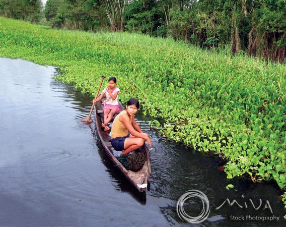 Miva Stock_1155 - Brazil, Amazon river, Canoe, girls