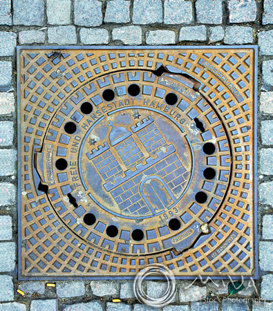 Miva Stock_1985 - Germany, Hamburg, Manhole cover