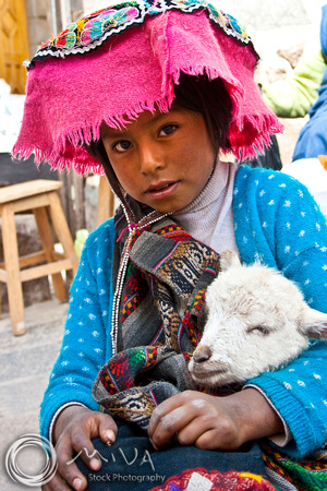 Miva Stock_1209 - Peru, Pisac, girl and lamb at market